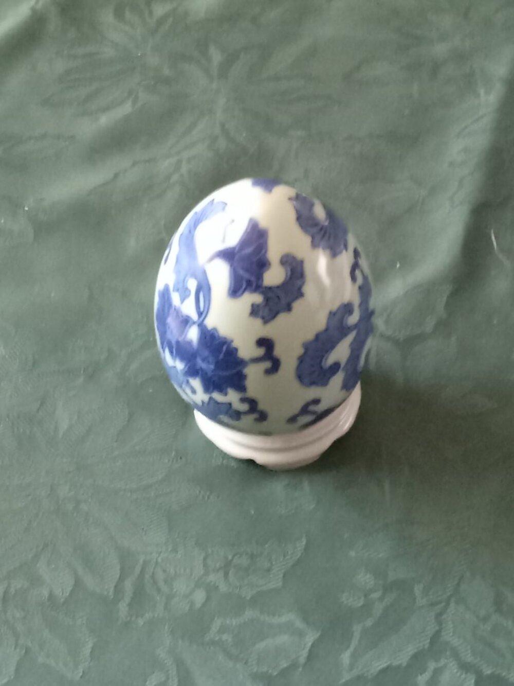 Vintage decorative blue and white egg with stand